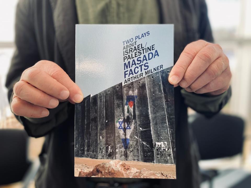 Regina playwright Arthur Milner holds a copy of his book of plays tackling life in Israel/Palestine. 