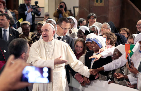 Pope Francis greets the faithful as he leaves Saint Peter's Cathedral in Rabat, Morocco, March 31, 2019. REUTERS/Youssef Boudlal