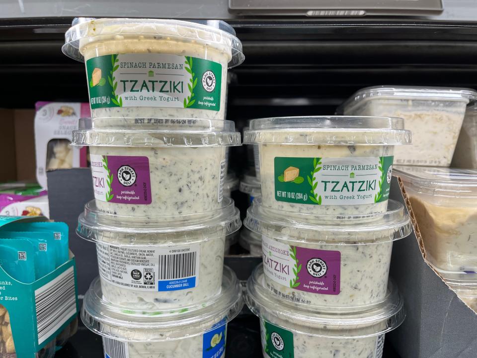 Containers of spinach-Parmesan tzatziki with Greek Yogurt.
