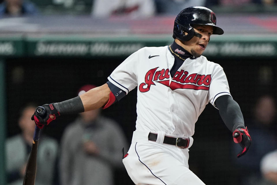 Cleveland Indians' Cesar Hernandez hits a two-run triple in the sixth inning of a baseball game against the Baltimore Orioles, Wednesday, June 16, 2021, in Cleveland. (AP Photo/Tony Dejak)