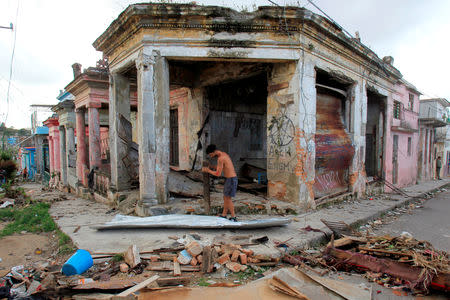 A man works near debris after a tornado ripped through a neighbourhood in Havana, Cuba January 28, 2019. REUTERS/Stringer