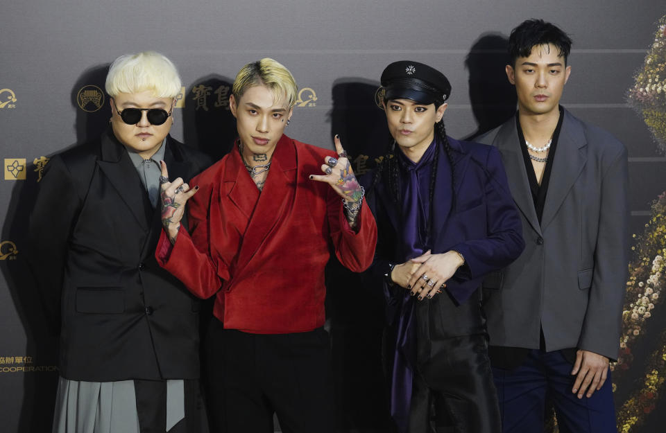 Taiwanese pop group Trash pose as they arrive for the 31th Golden Melody Awards in Taipei, Taiwan, Saturday, Oct. 3, 2020. The awards show, one of the world's biggest Chinese-language pop music annual events was postponed from June to Oct. due to the coronavirus pandemic. (AP Photo/Billy Dai)