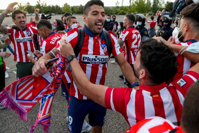 Luis Suarez celebrates with Atletico Madrid fans on Saturday after his winning goal at Real Valladolid clinched the LaLiga title on the final day of the season