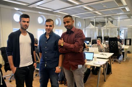 Nabard Jawad (L to R), Eyas Taha and Sharmake Abukar Amin pose for a picture at startup Integrify’s office in Helsinki, Finland, May 2, 2016. REUTERS/Tuomas Forsell