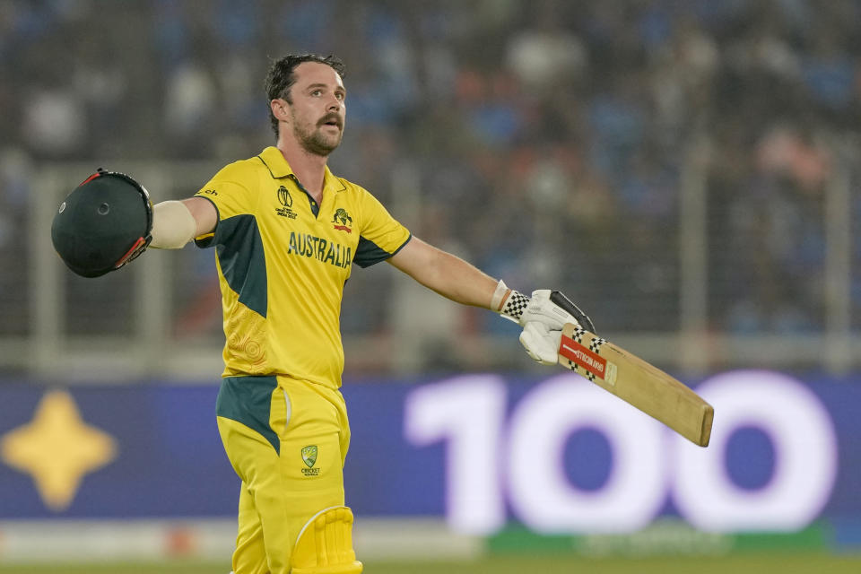 Australia's Travis Head celebrates after scoring a century during the ICC Men's Cricket World Cup final match between Australia and India in Ahmedabad, India, Sunday, Nov.19, 2023. (AP Photo/Mahesh Kumar A.)