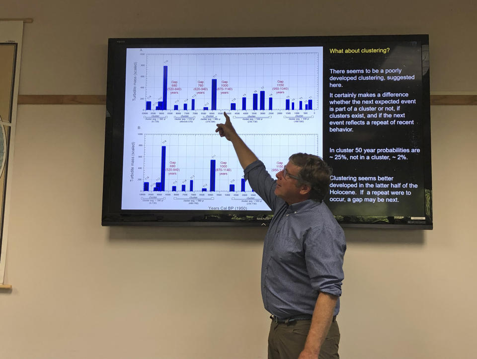 In this July 22, 2019, photo, Chris Goldfinger, an Oregon State University professor and expert on earthquakes and tsunamis, talks to the media about the probability of a large tsunami-generating earthquake occurring off the Oregon coast in Newport, Ore. Goldfinger is sharply critical of a recent repeal of a ban on construction of critical facilities in tsunami inundation zones in Newport, Ore. (AP Photo/Andrew Selsky)