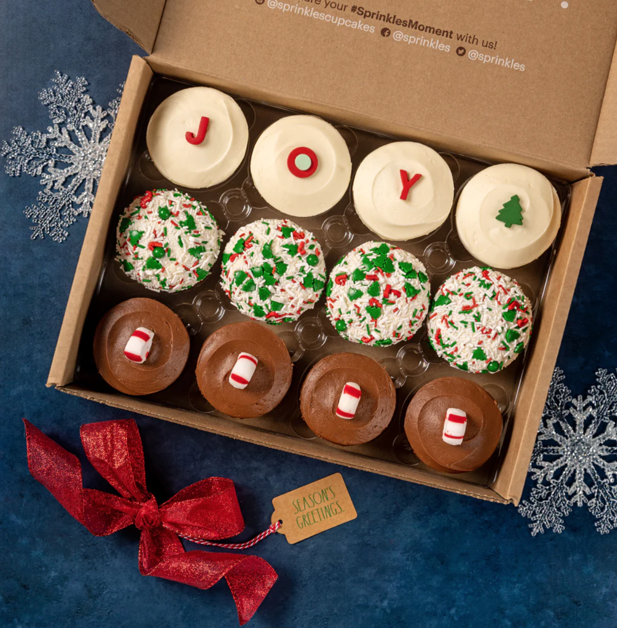 <p><a href="https://go.redirectingat.com?id=74968X1596630&url=https%3A%2F%2Fsprinkles.com%2Fproducts%2Fholiday-assorted-dozen-free-shipping&sref=https%3A%2F%2Fwww.thepioneerwoman.com%2Fholidays-celebrations%2Fgifts%2Fg34212065%2Fbest-white-elephant-gift-ideas%2F" rel="nofollow noopener" target="_blank" data-ylk="slk:Shop Now;elm:context_link;itc:0;sec:content-canvas" class="link rapid-noclick-resp">Shop Now</a></p><p>Holiday Assorted Dozen Cupcakes</p><p>sprinkles.com</p><p>$80.00</p><span class="copyright">Sprinkles</span>