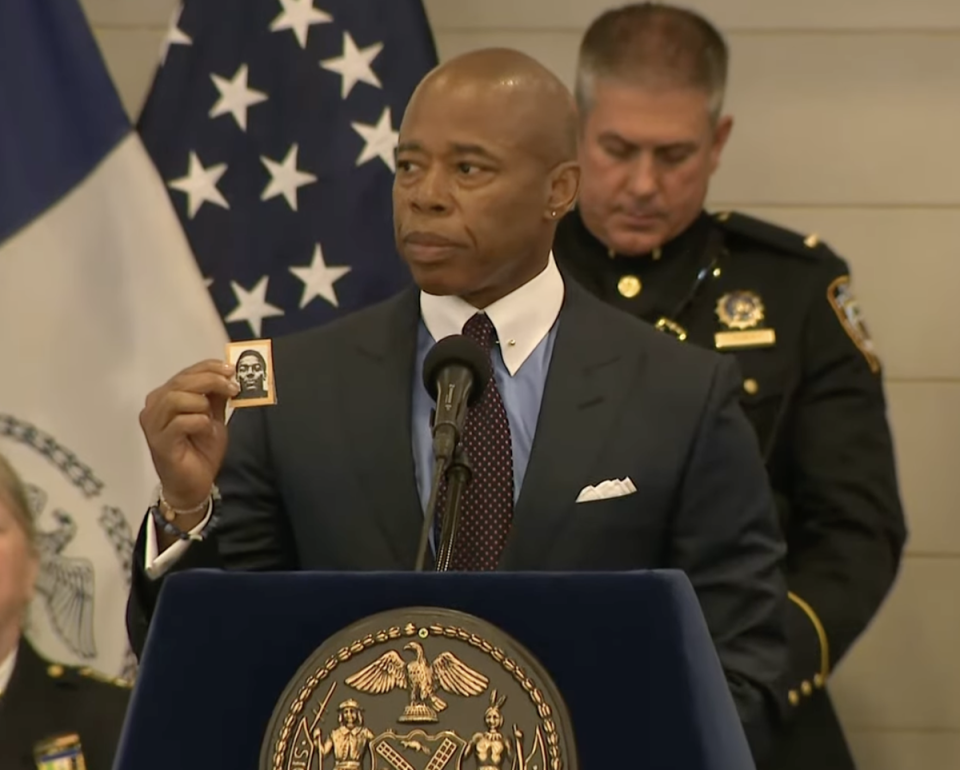 New York Mayor Eric Adams holds up a photograph of NYPD officer Robert Venable, who was killed in the line of duty in 1987, at an NYPD Medal Ceremony in 2022 (NYC Mayor’s Office)
