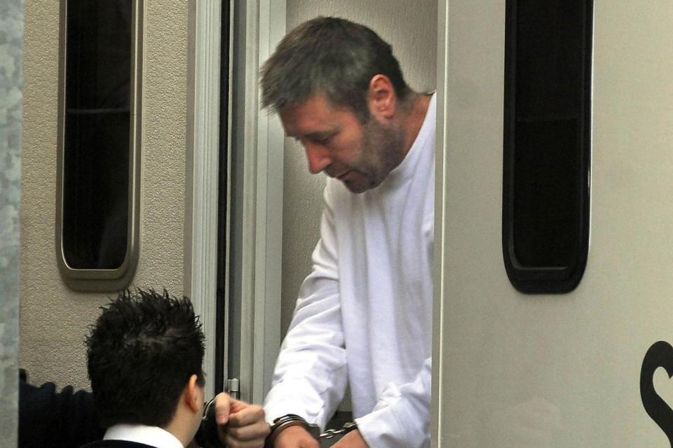 John Worboys in handcuffs for court in 2008