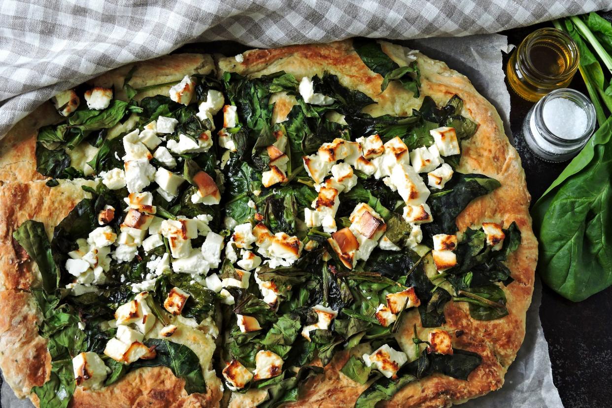 Homemade fresh pizza with spinach and feta cheese. Keto diet. Keto lunch idea. Colorful healthy food.