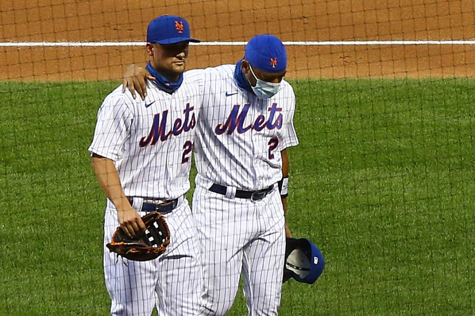 NEW YORK, NEW YORK - AUGUST 27: Dominic Smith #2 and J.D. Davis #28 of the New York Mets walk off the field prior to the start of the game against the Miami Marlins at Citi Field on August 27, 2020 in New York City. Several sporting leagues across the nation are postponing their schedules as players protest the shooting of Jacob Blake by Kenosha, Wisconsin police. (Photo by Mike Stobe/Getty Images)