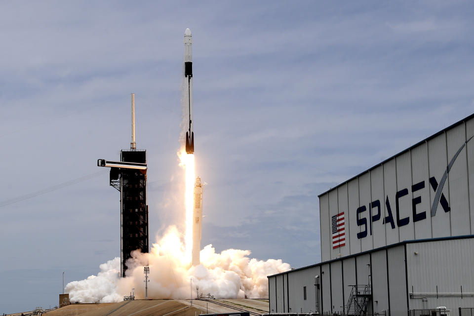 A SpaceX Falcon 9 rocket with a Dragon 2 spacecraft lifts off on pad 39A at the Kennedy Space Center for a re-supply mission to the International Space Station from Cape Canaveral, Fla., Thursday, June 3, 2021. (AP Photo/John Raoux)