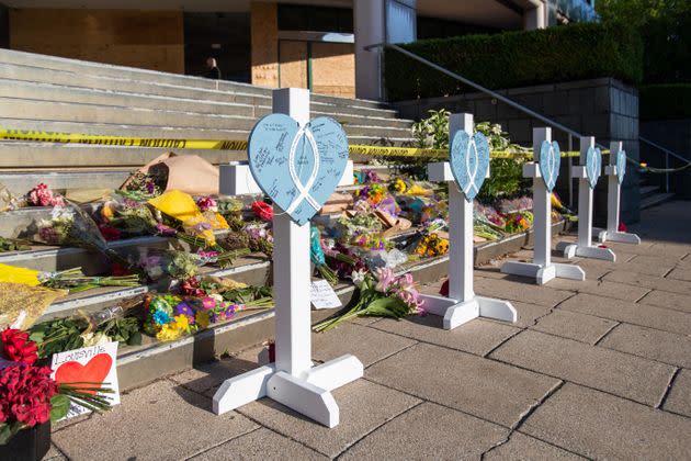 A makeshift memorial is set up on the steps of Old National Bank in Louisville, Kentucky, where a gunman, a 25-year-old bank employee, opened fire Monday, killing five people and wounding at least eight others before police fatally shot him.