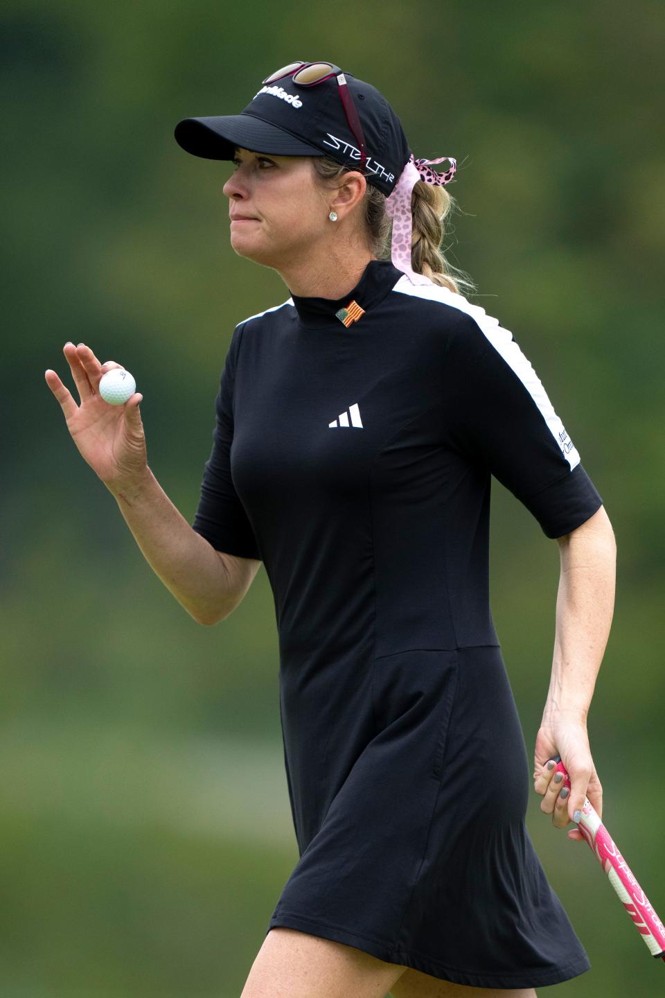 Paula Creamer, of Pleasanton, Calif., waives after putting on hole 1 during round 1 of the 2023 Kroger Queen City Championship in at Kenwood Country Club in Madeira, Ohio, on Thursday, Sept. 7, 2023.