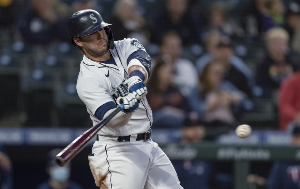 Seattle Mariners' Ty France hits an RBI-single off of Minnesota Twins relief pitcher Griffin Jax during the sixth inning of a baseball game Tuesday, June 15, 2021, in Seattle. (AP Photo/Stephen Brashear)