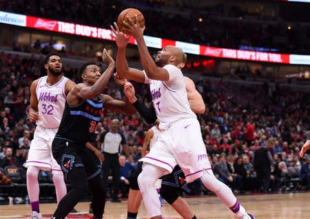 Dec 26, 2018; Chicago, IL, USA; Minnesota Timberwolves forward Taj Gibson (67) attempts to shoot the ball against Chicago Bulls forward Wendell Carter Jr. (34) during the second half at the United Center. Mandatory Credit: Mike DiNovo-USA TODAY Sports