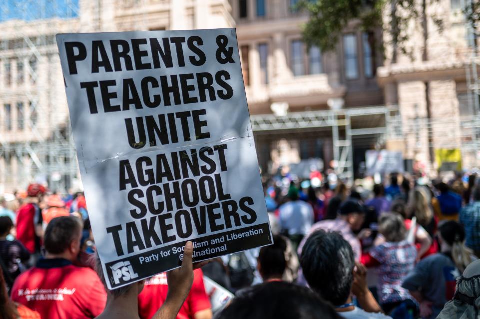 Protesters rally outside the Capitol on Oct. 7 to oppose school choice plans that would use public money for students to use at private schools.