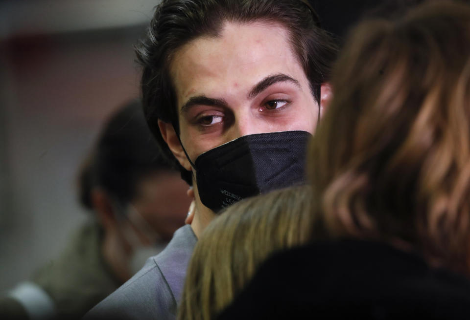 Damiano David of Italian band Maneskin, turns as he listens to reporters' questions upon their arrival at Rome's Fiumicino airport, Sunday, May 23, 2021. The glam rock band who got their start busking on Rome's main shopping drag won the Eurovision Song Contest Saturday and brought next year's competition back to the place where Europe's song contests began. (AP Photo/Alessandra Tarantino)