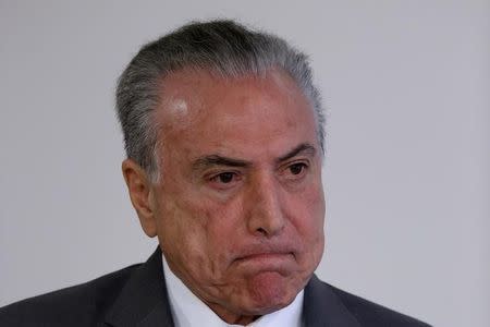 Brazil's President Michel Temer reacts during a ceremony at the Planalto Palace in Brasilia, Brazil April 12, 2017. REUTERS/Ueslei Marcelino