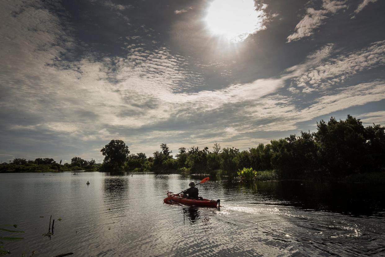 Kayakers paddle along a marked paddle trail that opened in 2018 in Tenoroc Wildlife Management area in Lakeland