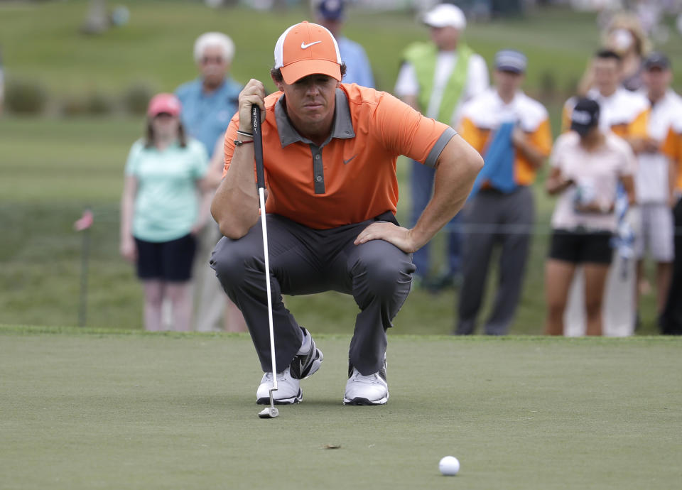 Rory McIlroy of Northern Ireland lines up a putt on the fourth hole during the first round of the Honda Classic golf tournament, Thursday, Feb. 27, 2014, in Palm Beach Gardens, Fla. (AP Photo/Lynne Sladky)