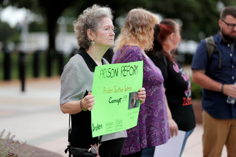 Doris Steele, who's son Joseph Stephens is incarcerated at Great Plains Correctional Center in Hinton, Okla., holds a sign as she and others with the criminal justice advocacy group Hooked on Justice gather outside the Capitol in Oklahoma City, Wednesday, May 22, 2024.