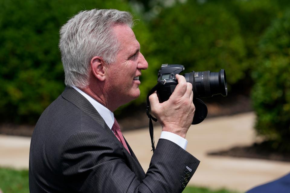 House Minority Leader Kevin McCarthy, R-Calif., holds the camera of Sen. Patrick Leahy, D-Vt., during an event in the Rose Garden of the White House in Washington, Monday, July 26, 2021, to highlight the bipartisan roots of the Americans with Disabilities Act and marking the law's 31st anniversary.