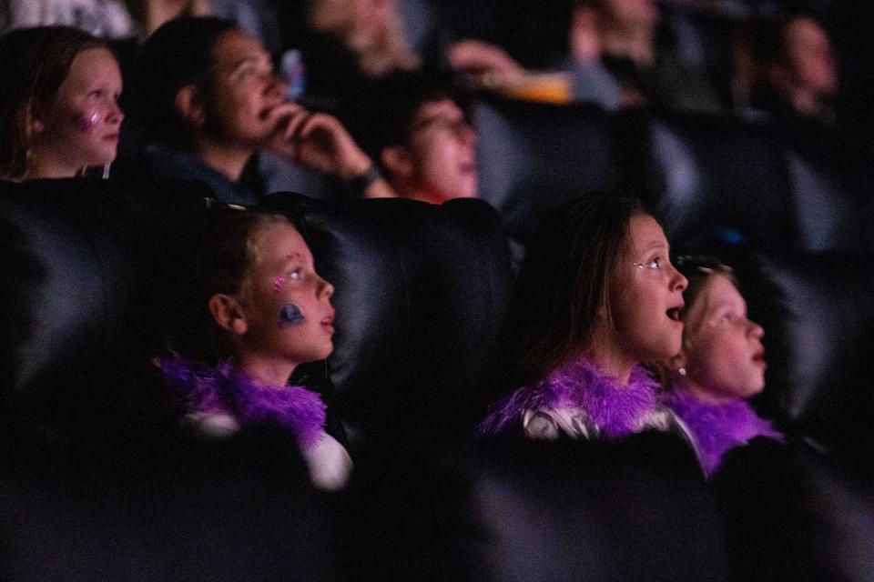 Taylor Swift fans sing along as they watch “Taylor Swift: The Eras Tour” at Malco Paradiso Cinema Grill and IMAX in Memphis, Tenn., on Saturday, October 14, 2023.