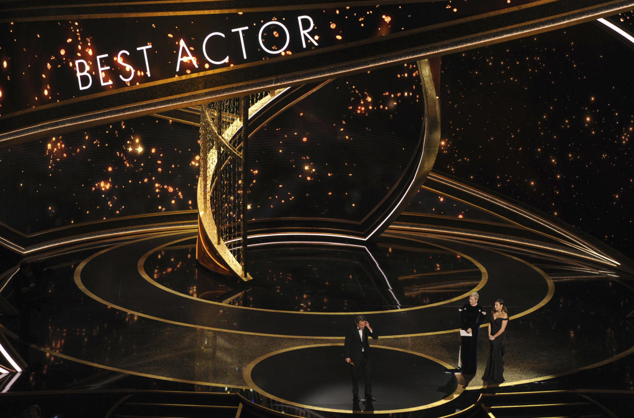 Joaquin Phoenix accepts the award for best performance by an actor in a leading role for "Joker" at the Oscars on Sunday, Feb. 9, 2020, at the Dolby Theatre in Los Angeles. (AP Photo/Chris Pizzello)