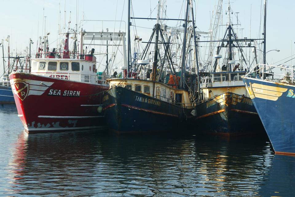 FILE - This April 30, 2004 file photograph shows fishing boats docked at the pier in New Bedford, Mass. The U.S. seafood catch reached a 17-year high in 2011, with all fishing regions of the country showing increases in both the volume and value of their harvests. New Bedford, Mass., had the highest-valued catch for the 12th straight year, due largely to its scallop fishery. (AP Photo/Stew Milne)