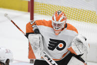 Philadelphia Flyers goaltender Brian Elliott (37) stops the puck during the second period against the Washington Capitals in an NHL hockey game Tuesday, April 13, 2021, in Washington. (AP Photo/Nick Wass)