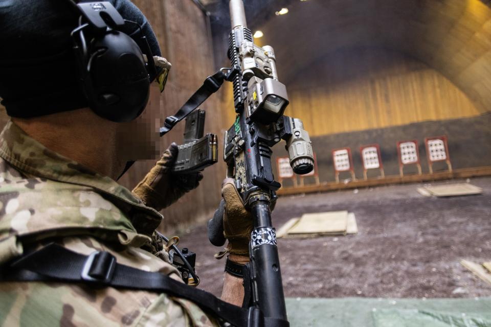 US Army Special Forces soldier reloads M4 carbine