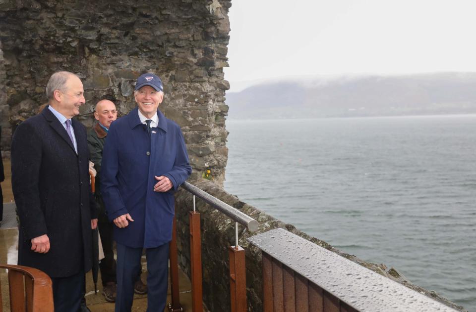 Biden and Irish deputy prime minister Micheal Martin (L) visit Carlingford Castle earlier (EPA)
