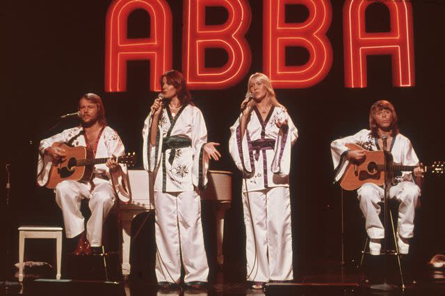 <p>Hulton Archive/Getty </p> ABBA performing