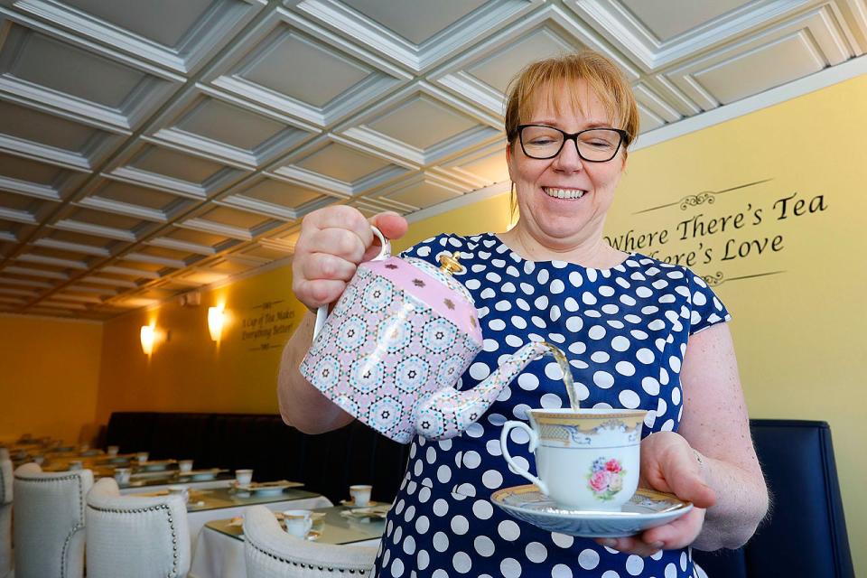 Michelle Sinclair, a native of England, pours a cup of tea at Shelly's Tea Rooms on Court Street in Plymouth on Monday, Feb. 28, 2022.
