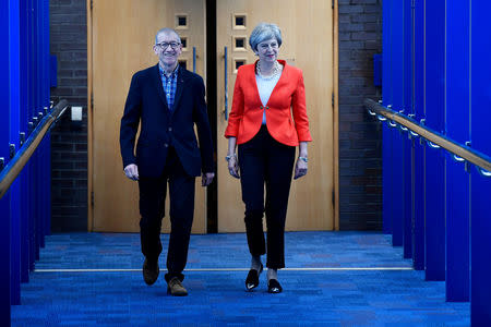 Britain's Prime Minister Theresa May and husband Philip walk to the Conservative Party Conference in Birmingham, Britain September 30, 2018. REUTERS/Toby Melville