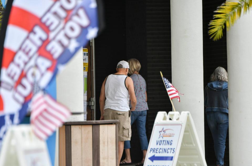 People wait in line to vote at Palm Bay, FL City Hall Tuesday, Nov. 3, 2020. Mandatory Credit: Craig Bailey/FLORIDA TODAY via USA TODAY NETWORK