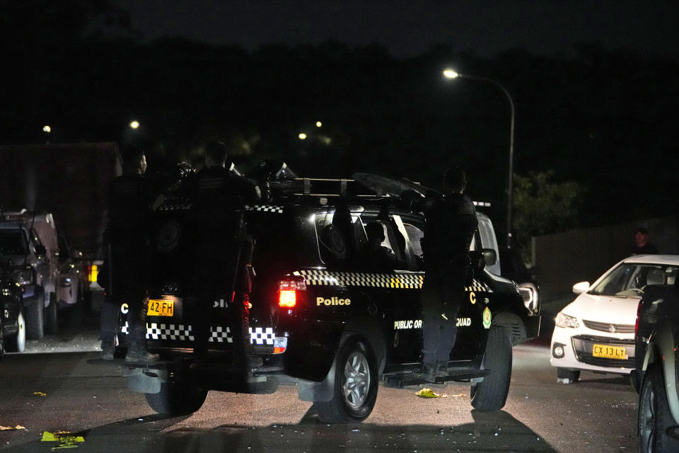 Riot police drives away after securing outside a church where a bishop and churchgoers were reportedly stabbed in Sydney Australia, Monday, April 15, 2024. Police in Australia say a man has been arrested after a bishop and churchgoers were stabbed in the church. There are no life-threatening injuries. (AP Photo/Mark Baker)