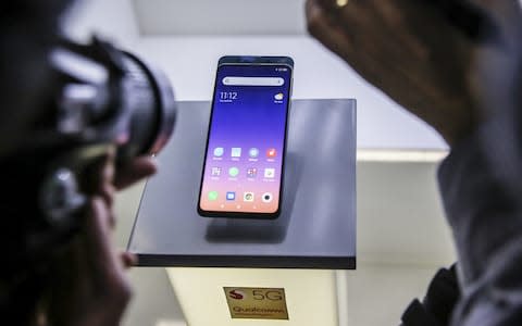 Mi Mix 3 5G smartphone on display during a Xiaomi Corp. launch event ahead of the MWC Barcelona in Barcelona - Credit: Bloomberg