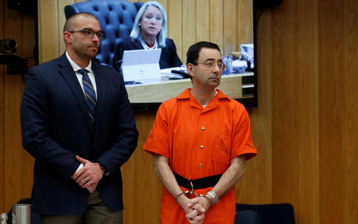 Larry Nassar stands with attorney Matt Newburg during his second sentencing hearing on Jan. 31. (Photo: Rebecca Cook/Reuters)