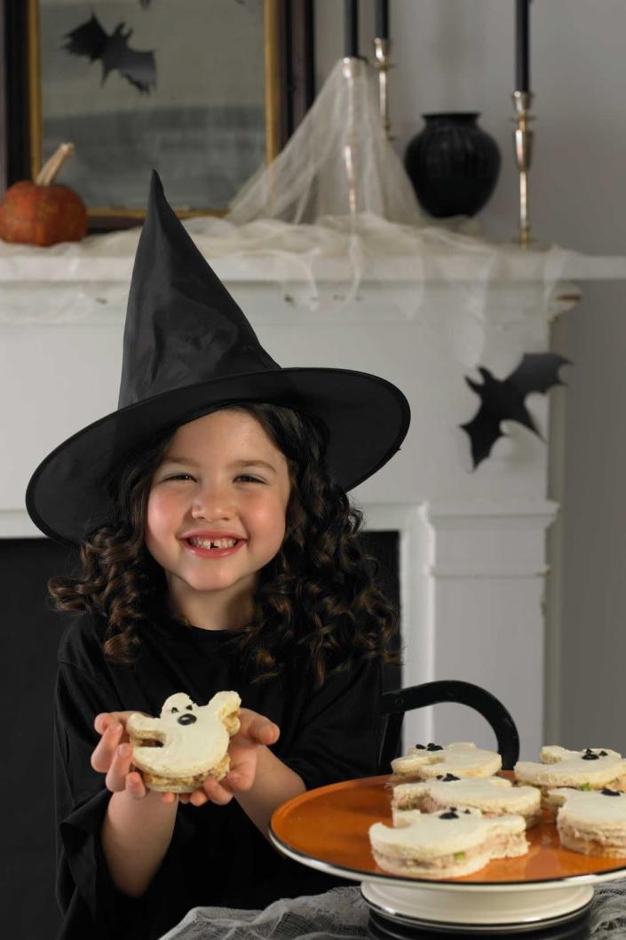 <p>To create these friendly apparitions, simply cut through white bread with a ghost-shaped cookie cutter and spread some chicken salad between two slices. Add a thin layer of cream cheese to the top first then decorate with olive slices.</p><p><em><a href="https://www.womansday.com/food-recipes/food-drinks/recipes/a9993/little-ghost-sandwiches-recipe-121372/" rel="nofollow noopener" target="_blank" data-ylk="slk:Get the Ghost Sandwiches recipe." class="link rapid-noclick-resp">Get the Ghost Sandwiches recipe.</a></em> </p>
