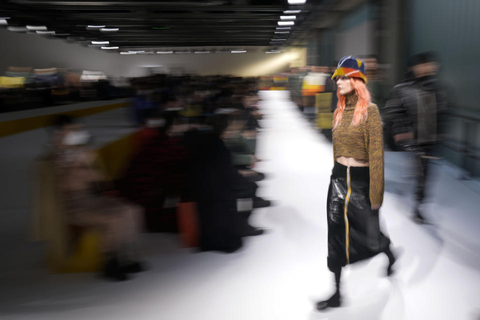 Models wear creations as part of the K-Way men's Fall-Winter 2022-23 collection, unveiled during the Fashion Week in Milan, Italy, Monday, Jan. 17, 2022. (AP Photo/Antonio Calanni)