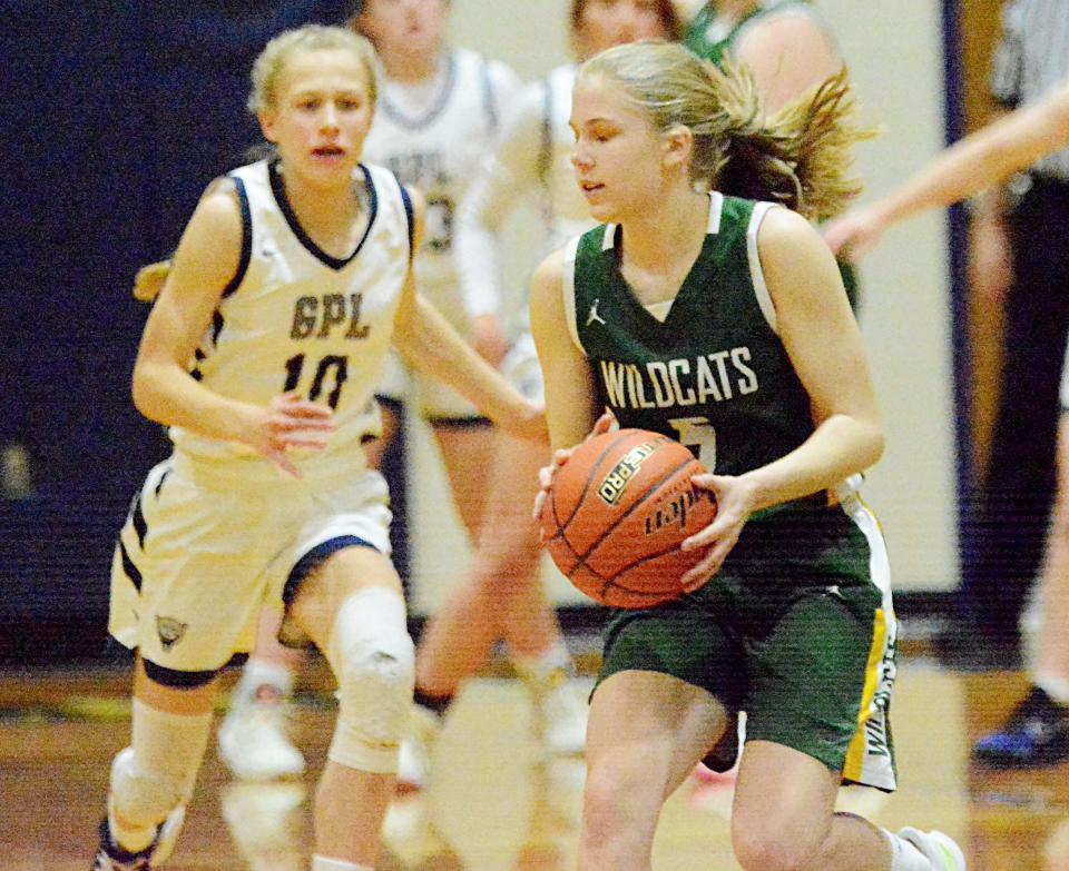 Northwestern's Josie Sparling tracks down a loose ball in front of Great Plains Lutheran's Katherine Prahl during a high school basketball doubleheader on Thursday, Feb. 9, 2023 in Watertown.