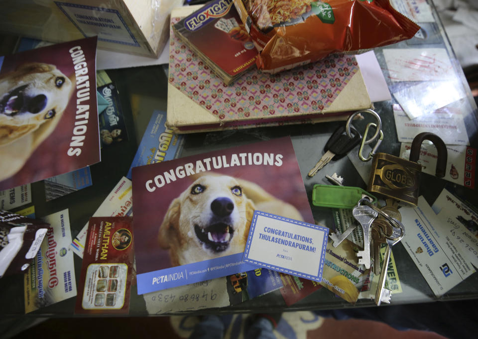 Congratulatory cards sent with boxes of packaged food and sweets by a non-government organization to be distributed among villagers lie at the desk of a Hindu temple official ahead of the inauguration of U.S. Vice President-elect Kamala Harris, in Thulasendrapuram, the hometown of Harris' maternal grandfather, south of Chennai, Tamil Nadu state, India, Tuesday, Jan. 19, 2021. The inauguration of President-elect Joe Biden and Vice President-elect Kamala Harris is scheduled be held Wednesday. (AP Photo/Aijaz Rahi)