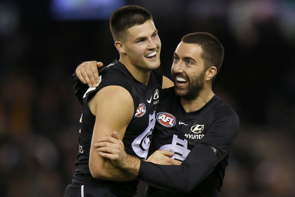 Nic Newman of the Blues celebrates a goal with team mate Kade Simpson.