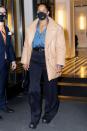 <p>Tracee Ellis Ross leaves her hotel in N.Y.C. on Thursday looking chic in black trousers, a denim blouse and leather jacket. </p>