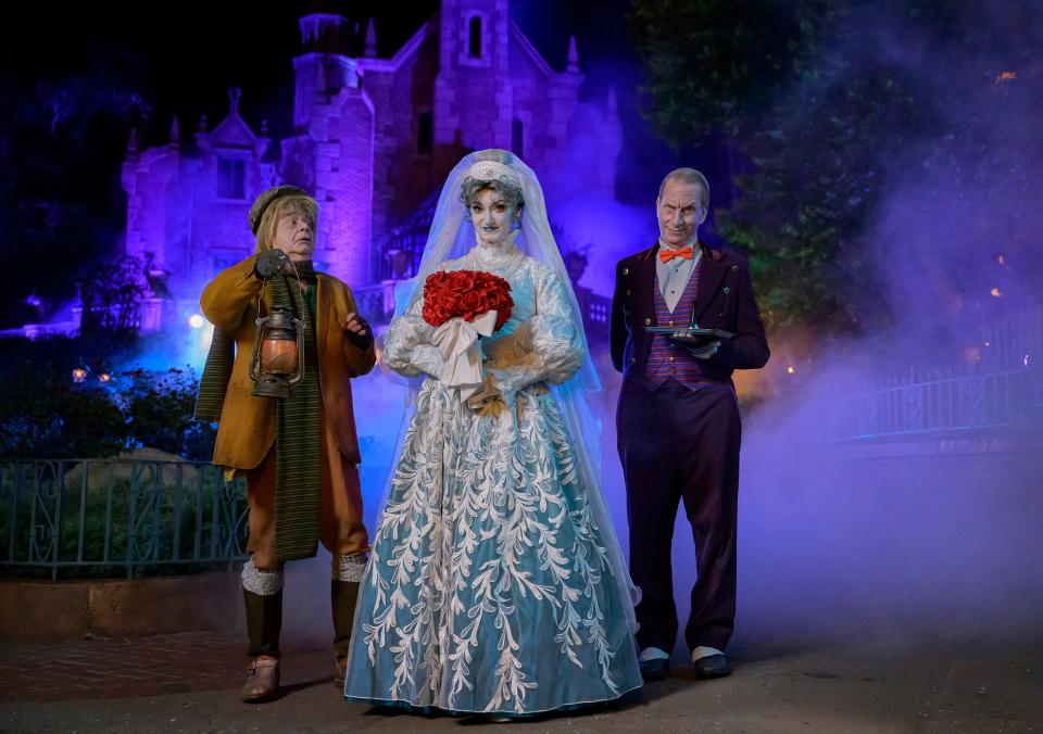 Residents of the Haunted Mansion materialize to greet guests at Mickey's Not-So-Scary Halloween Party at Disney's Magic Kingdom.