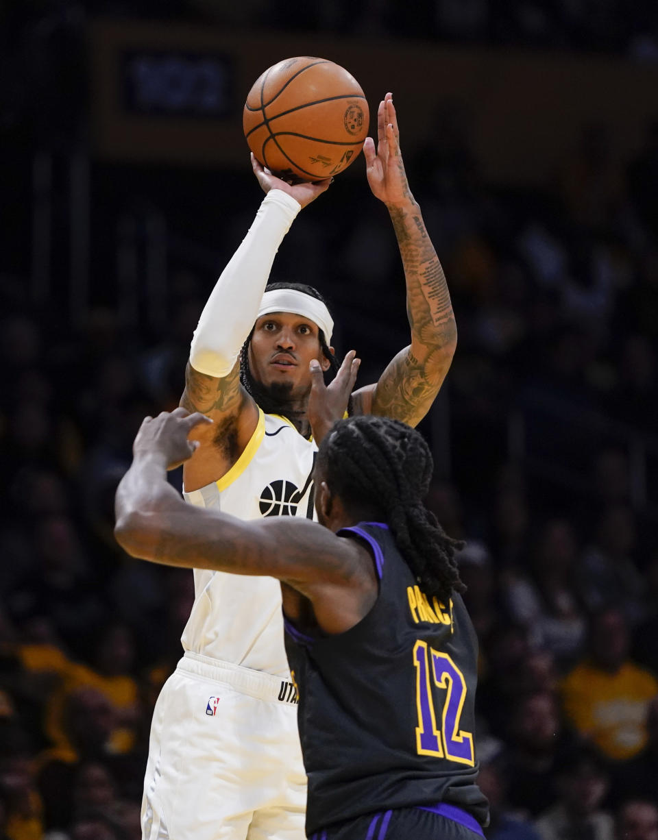 Utah Jazz guard Jordan Clarkson shoots as Los Angeles Lakers forward Taurean Prince defends during the first half of an NBA basketball in-season tournament game Tuesday, Nov. 21, 2023, in Los Angeles. (AP Photo/Ryan Sun)