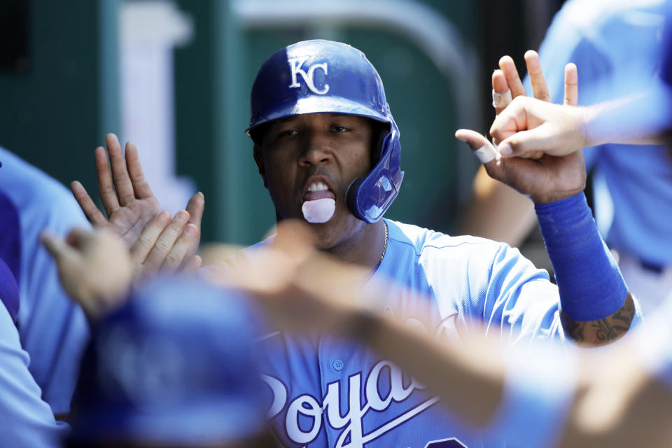 Kansas City Royals' Salvador Perez celebrates in the dugout after scoring off a Jarrod Dyson double in the third inning of a baseball game against the Boston Red Sox at Kauffman Stadium in Kansas City, Mo., Sunday, June 20, 2021. (AP Photo/Colin E. Braley)