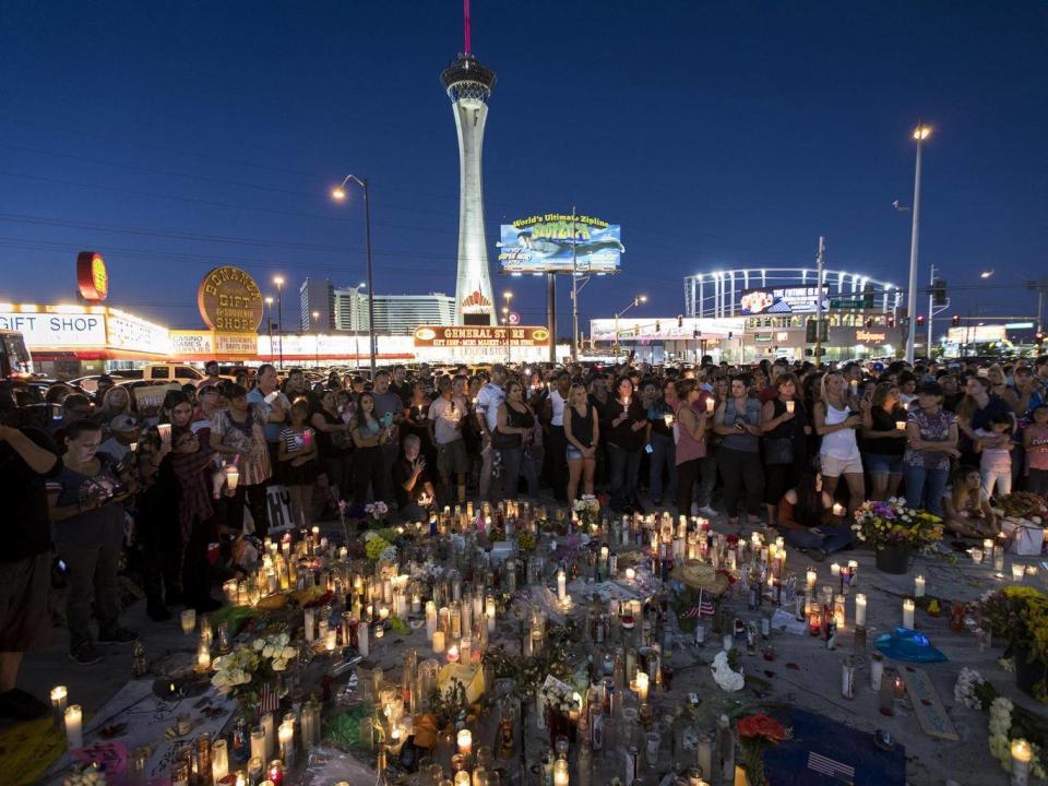 Mourners attend a vigil to mark the mass shooting at the Route 91 Harvest country music festival (Getty)